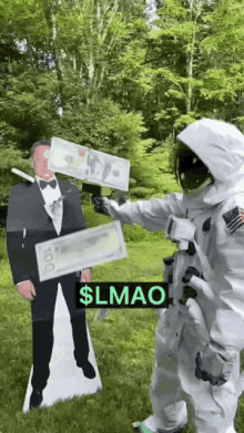 a cardboard cutout of a man in a tuxedo is being held up by a person in a space suit