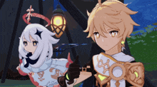a boy and a girl are standing next to each other and the girl is giving a thumbs up