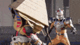 two robots are fighting each other and one of them is wearing a pyramid .