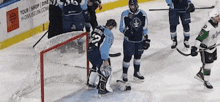a hockey player with the number 12 on his jersey is standing on the ice
