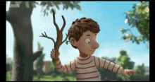 a boy in a striped shirt is holding a stick with bbc written on the bottom