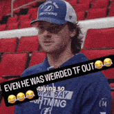 a man wearing a tampa bay lightning baseball cap