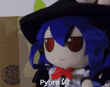 a stuffed doll with blue hair and red eyes says pybro v2 on it