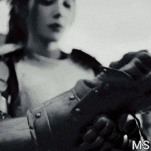 a black and white photo of a woman with the word ms on the bottom