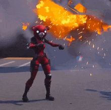 a woman is standing in front of an explosion with the word boom on it