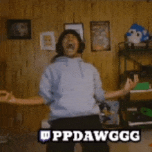 a person with their arms outstretched in a room with the words ppdawgg on the bottom