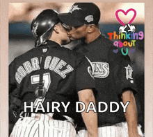 a couple of baseball players kissing with the words hairy daddy written below them