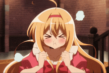 a girl with long blonde hair is making a funny face with her eyes closed