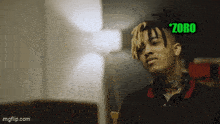 a young man with dreadlocks and the word zoro on the bottom