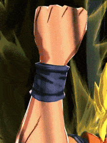 a close up of a person 's fist with a blue wristband around it .