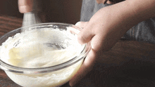 Whisking Cream Cheese Two Plaid Aprons GIF - Whisking Cream Cheese Two Plaid Aprons Mixing The Cream Cheese GIFs