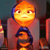 an animated character from the movie elemental is holding a bowl of popcorn .