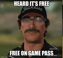 a man with a mustache and glasses wearing a hat that says titleist