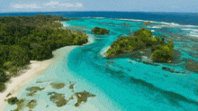 an aerial view of a tropical island with a white sandy beach