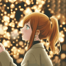 a girl with a ponytail and earrings looks up at the sky