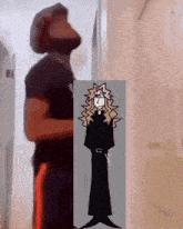 a man with a beard is standing next to a picture of a priest