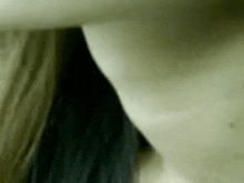 a close up of a woman 's neck and chest .