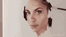 a painting of a woman 's face is made in animotoca