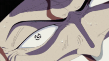 a close up of a person 's face with a white eye and a black circle on it