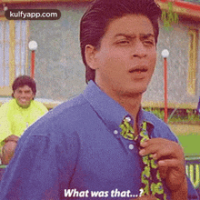 a man in a blue shirt and tie is asking what was that ?