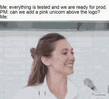 a woman in a white shirt is smiling in a kitchen with a pink unicorn above her logo .