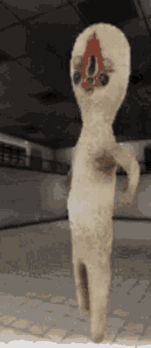 a stuffed animal with a hole in its face is standing on a tiled floor .