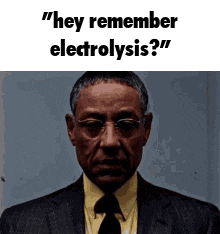a man in a suit and tie is asking someone if they remember electrolysis .