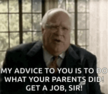 an older man in a suit and tie is talking to another man .