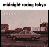 a sony ad for midnight racing tokyo shows a car driving down a city street