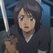 a girl is crying and holding a sword