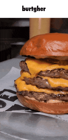 a hamburger with the word burtgher on the top