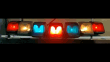 a bunch of red and yellow lights on a pole