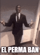 a man in a suit and tie is standing in a hallway with his arms outstretched and the caption el perma ban .