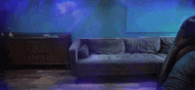 a man sitting in front of a couch with a re-subscribe button