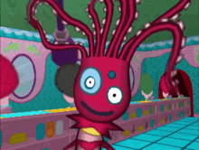 a cartoon drawing of a pink octopus with a blue eye