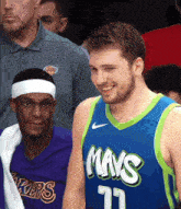 a man wearing a blue and green jersey that says mays on it