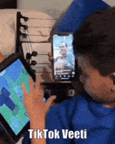 a person playing a video game with the words tiktok veeti on the bottom right