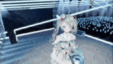 a girl in a white dress is standing on a stage in front of a crowd of people .