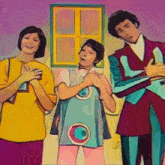 a group of people are standing next to each other in front of a window