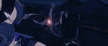 a person is holding a sword in a video game and a purple light is coming out of it .