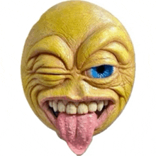 a yellow smiley face with a blue eye and a pink tongue sticking out