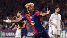 a soccer player wearing a jersey with a spotify logo on it