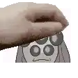 a hand is touching a cartoon character 's face with a towel .