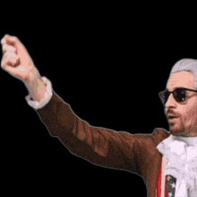 a man wearing sunglasses and a brown jacket is holding up a green light