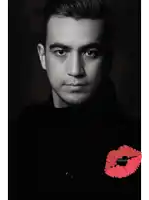 a black and white photo of a man with a red lip and the word shotole on it