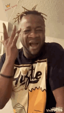 a man wearing a hustle shirt is making a face