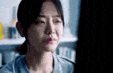 a close up of a woman 's face with tears running down her cheeks