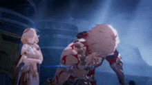 a man and a woman are standing next to each other in a dark room