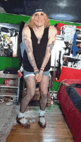 a man wearing shorts and stockings is standing in a room