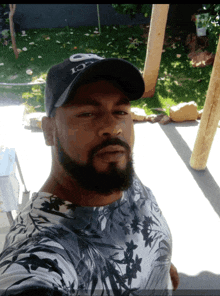 a man with a beard wears a hat that says gucci on it